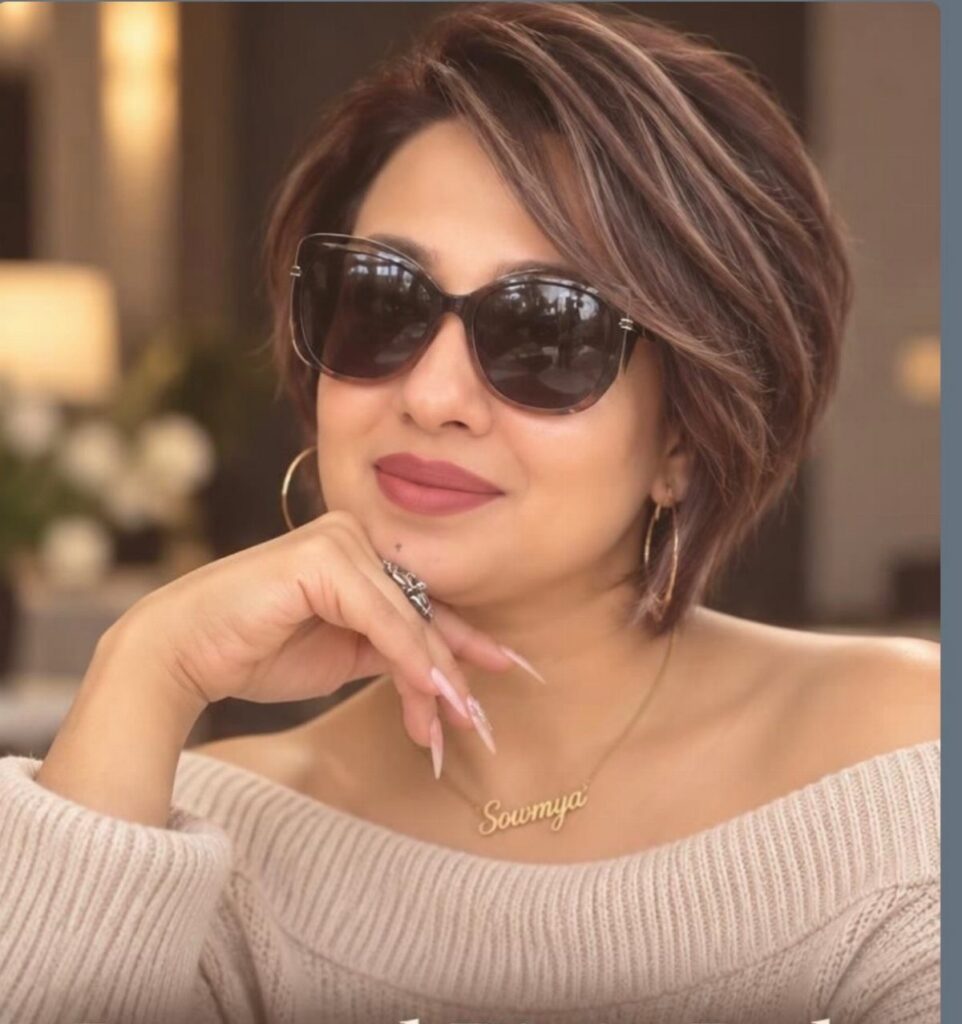 Woman showcasing short shaggy brown hair with side-swept layers and bangs